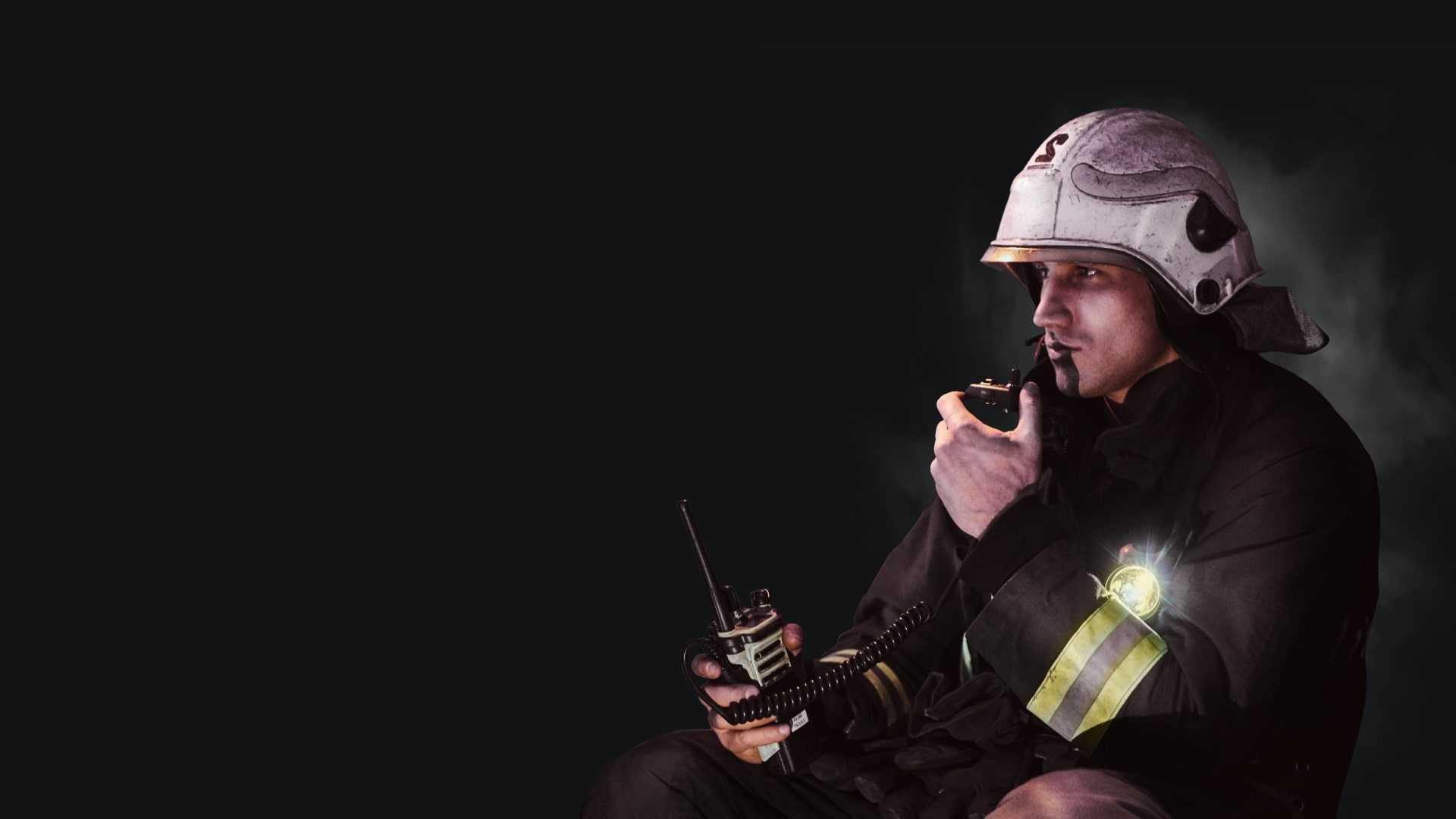 Firefighter communicating via radiostation